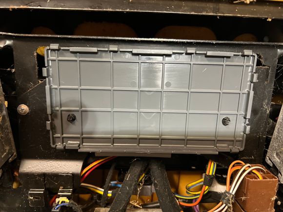 XJ8 attached by plastic screws under cushion