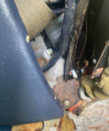 With console loosened and pulled rearwards you can access the 2 fixings to the cover plate.