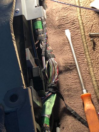 So if you want to tap into the rear right speaker you can do it from the passenger rear floor just remove the cover and find the pink/green wire that is twirled with the black and white wire