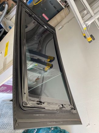 Underside of glass, showing mounting bracket.