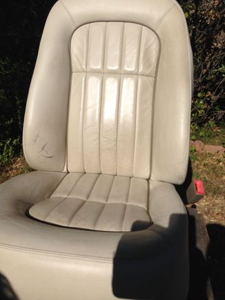 Passenger seat out of the car. showing hte wear along the side bolster.