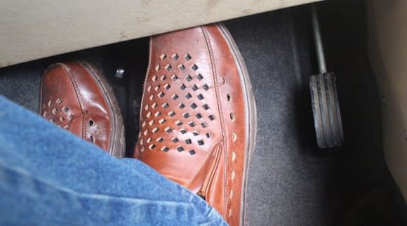 When changing from the gas pedal to brake, it seems as if you have to keep the toe of your Shoe in the space and then slide it over from one pedal to the other.