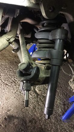 A decent handcranked spring compressor with removable "heads" found on ebay. Not especially expensive.