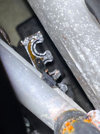 Zoomed in a bit. Hose connection with the issue is quite obvious with orange caked around the clamp.
It is over the edge of the under engine cover.