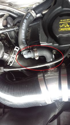 Went to the autoparts store, and got a small hose with a 90 degree bend, cut it to size and mated the to ends with a 90 degree elbow (will replace that PVC elbow with brass fittings when I find the correct size)