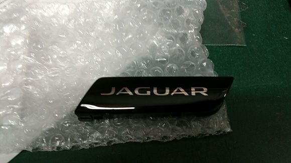 These are the parts. One for the left, the other for the right. 

C2D37036PMB Bezel
C2D37037PMB Bezel