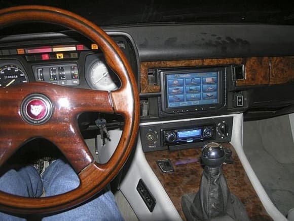 A shot of the dash with the touchscreen and Panasonic head unit lit up. This was shot before I removed them from the donor car. If you look closely, just beneath the stereo, you will see the DVD drive for the onboard PC.