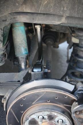 Top down view of what the new arm looks like.  This arms comes much closer to the CV axle than the old one did, but it misses and is no issue.