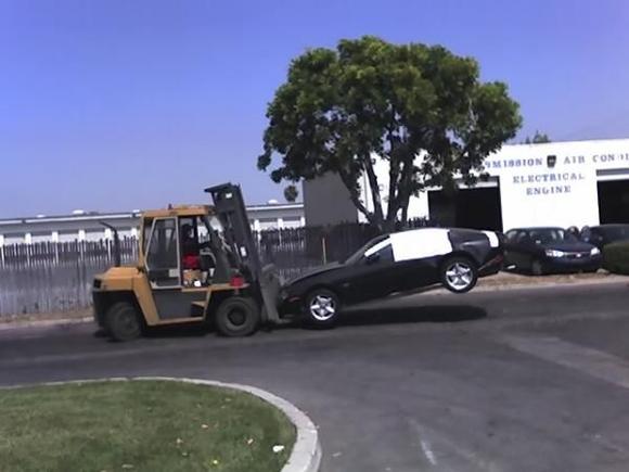 My car on a forklift.  That's just wrong