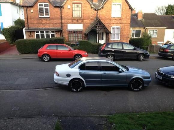 Day 3 - Another successful day spraying. Note the 18" wheels that I carbon fiber wrapped. Very nice stuff that carbon fiber wrapping.  Note the side windows were tinted by me, the rear was too fiddly so cost me £50 which was reasonable.  Also you may see the carbon fiber roof. This looks great, but it was temporary, during the white painting, and I will do this gloss black later :)