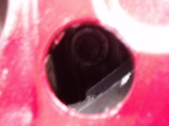 The differential fill plug is clearly visible.  My camera angle is to the right of the hole, so it appears there is more clearance on the left side than there actually is, thus I should have cut the hole slightly more to the left.