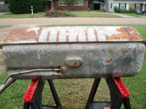 Tank out of vehicle, front and top-facing sides.