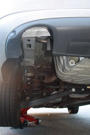 The empty hole left from the removed muffler