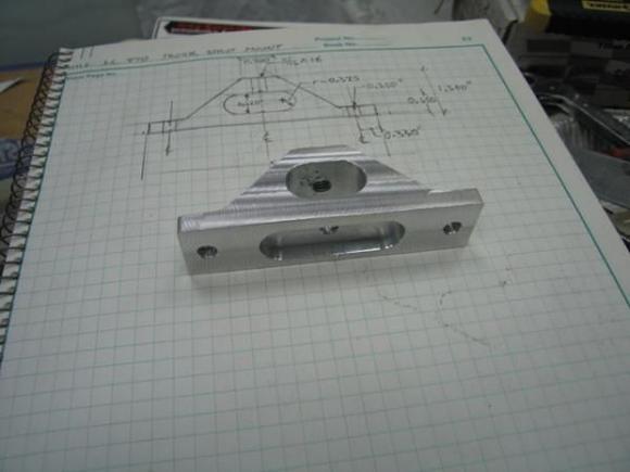 Fast-forwarding ahead several hours and here is the finished part compared with the design drawing (yes, it's a hand drafted drawing, my CAD system does not reside in the garage!).  Overall, pretty much exactly what i drew.