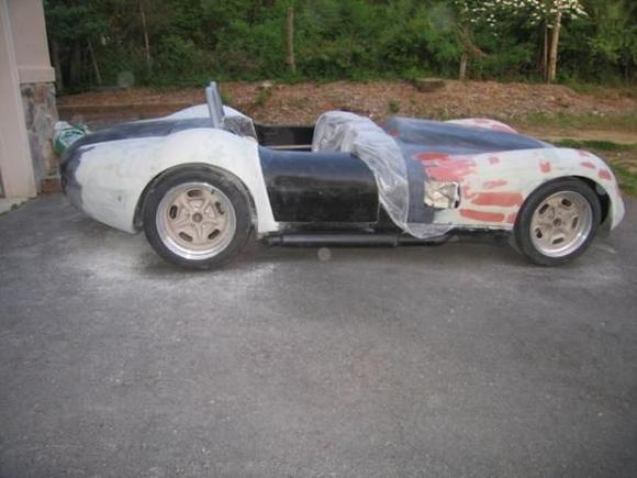 As the fenders come into the right shape I then add glazing putty to fill scratches and low spots (the reddish brown stuff).  While the fenders are getting smoother and better shaped, the putty makes them look even worseif that is possible.

Ok, so it still looks pretty roughbelieve it or notit is getting better.  I pretty much worked on it every weekend with a goal of getting it ready for paint by the end of the summer (a goal i did not attain).  Well, that is about it for this update.