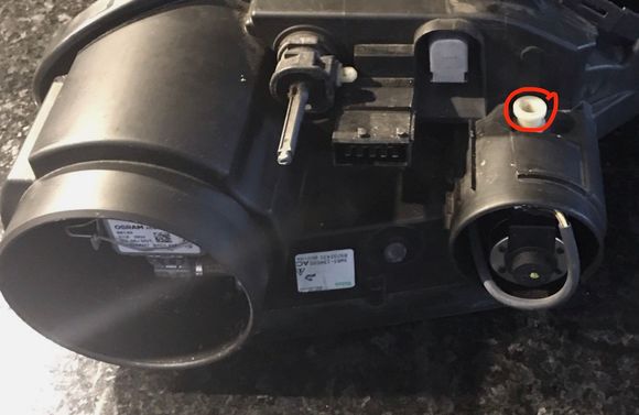 Circled white screw alters the dipped lights...where is the adjustment for the high beam ?