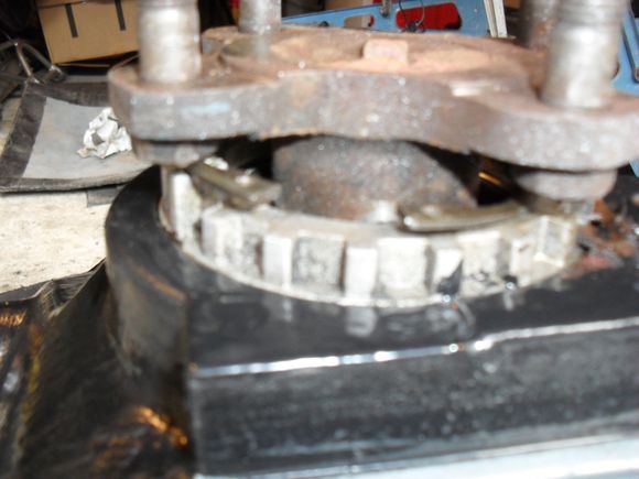 The circlip pops out of its groove but should not need to be fully removed from the output shaft.