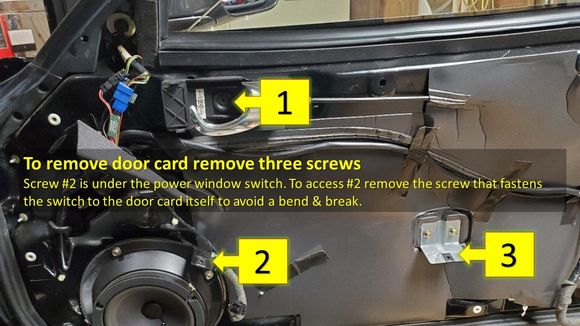 Remove three screws before attempting to pry the door card.