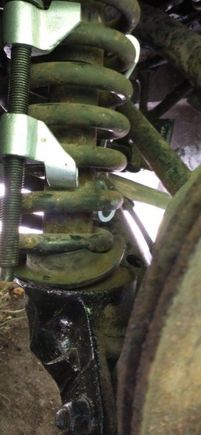 Bottom of spring out of perch.