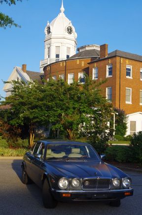 XJ6 modeling in front of the courthouse depicted in "To Kill a Mockingbird." This is a museum used now in the Monroeville, Ala., town play, along with the fake housefronts pictured behind and to the right of the car.
