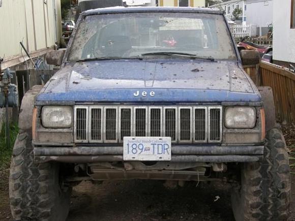 front end, with the 38's mounted, conveyer belt fender flares  and just a 2&quot; lift spacer in the front