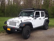 Front side shot of 2016 Rubicon unlimited Hardrock with lights and Gobi stealthrack