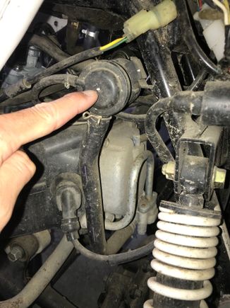 Disconnected hose runs to this part and has a big hose running to the silver block on the front of the engine