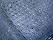 All-weather mats, front and back. Also includes original carpet mats.