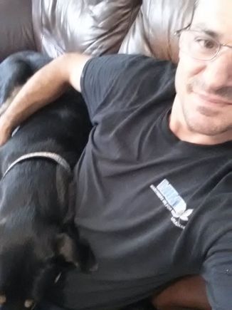My buddy Tucker and I getting some cuddle time. He's 2 years old, Lab/American Bulldog/Collie/Shepard. I've had him for 2 months in training as my second "emotional support dog".