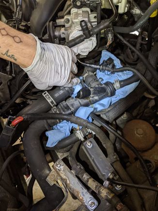 All of these hoses get disconnected! Drained the radiator first but it didn't help much. I suggest considering disconnecting them at different locations if possible to avoid draining coolant onto the engine and some electrical connectors which are mounted DIRECTLY BELOW COOLANT LINES. Tried my darndest to compensate for my absent-mindedness with shop towels