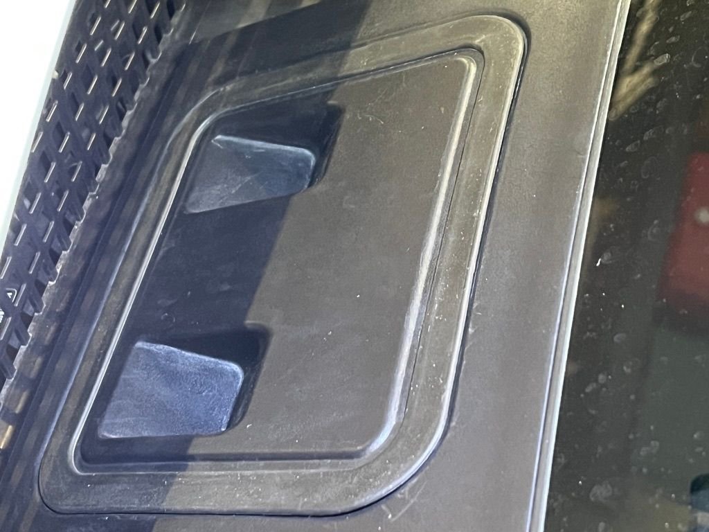 Top side of EQS SUV brake fluid reservoir cover.