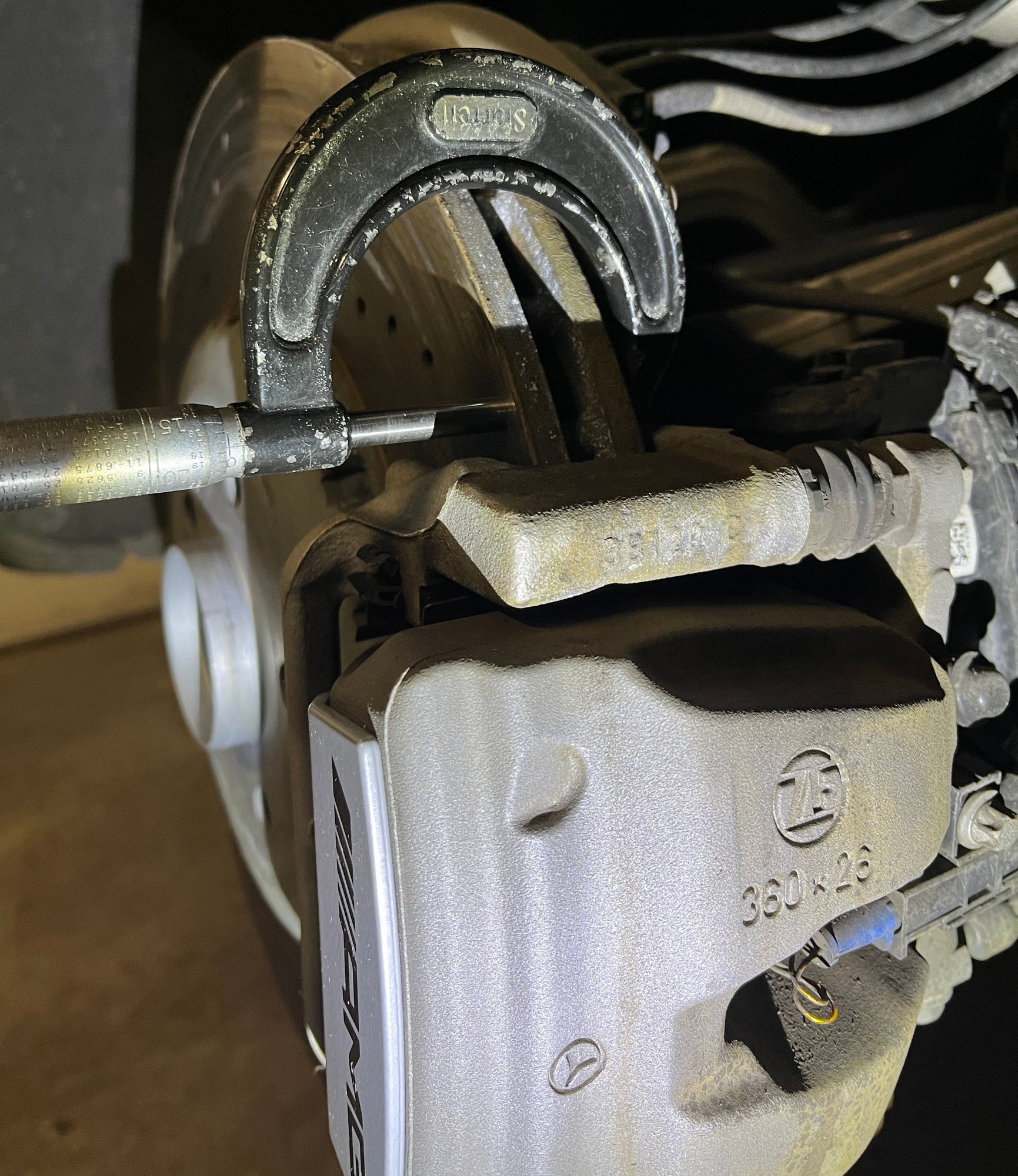 Measuring rear rotor thickness. 25.84mm after 21600 miles.