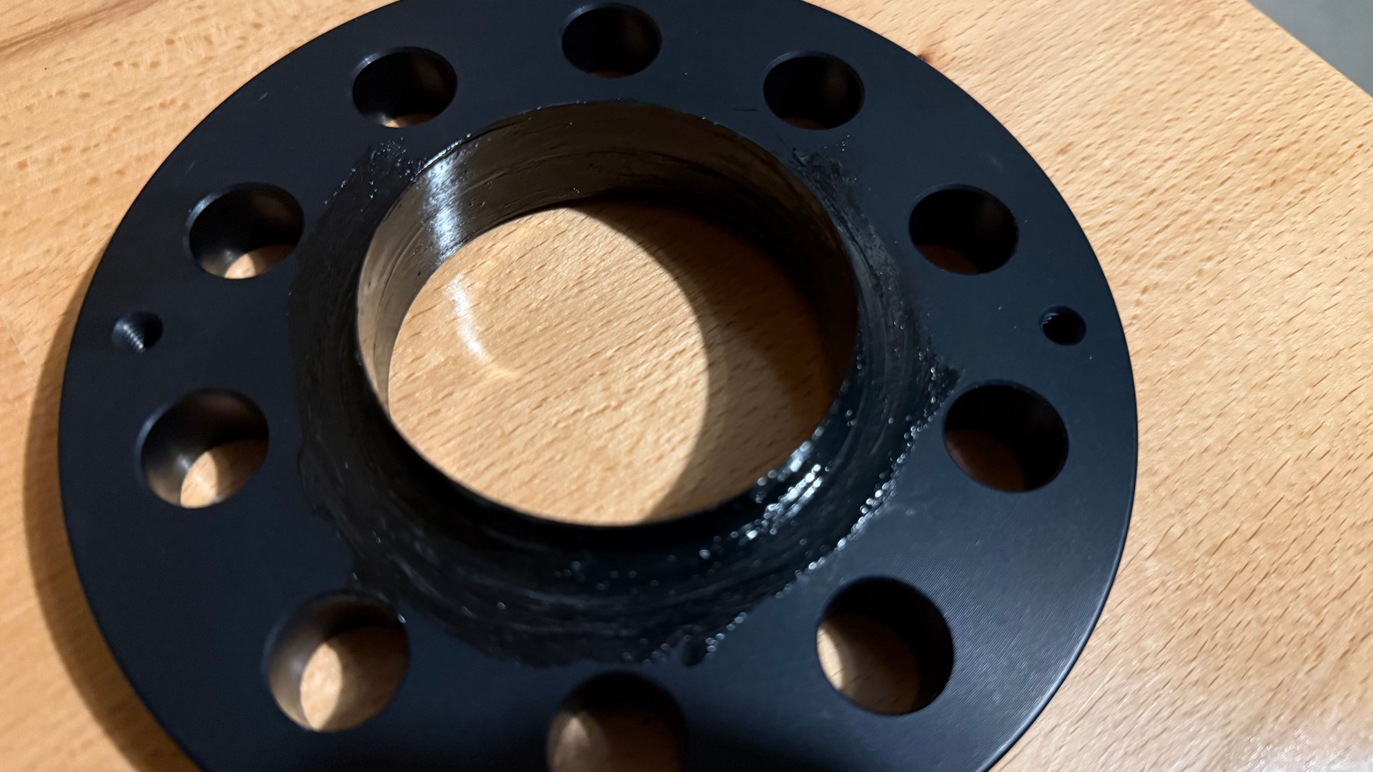 Greased inner and outer and very then layer on front and rear mounting surfaces then wiped the surfaces off. Left grease in the hub diameter parts (did not wipe off those)