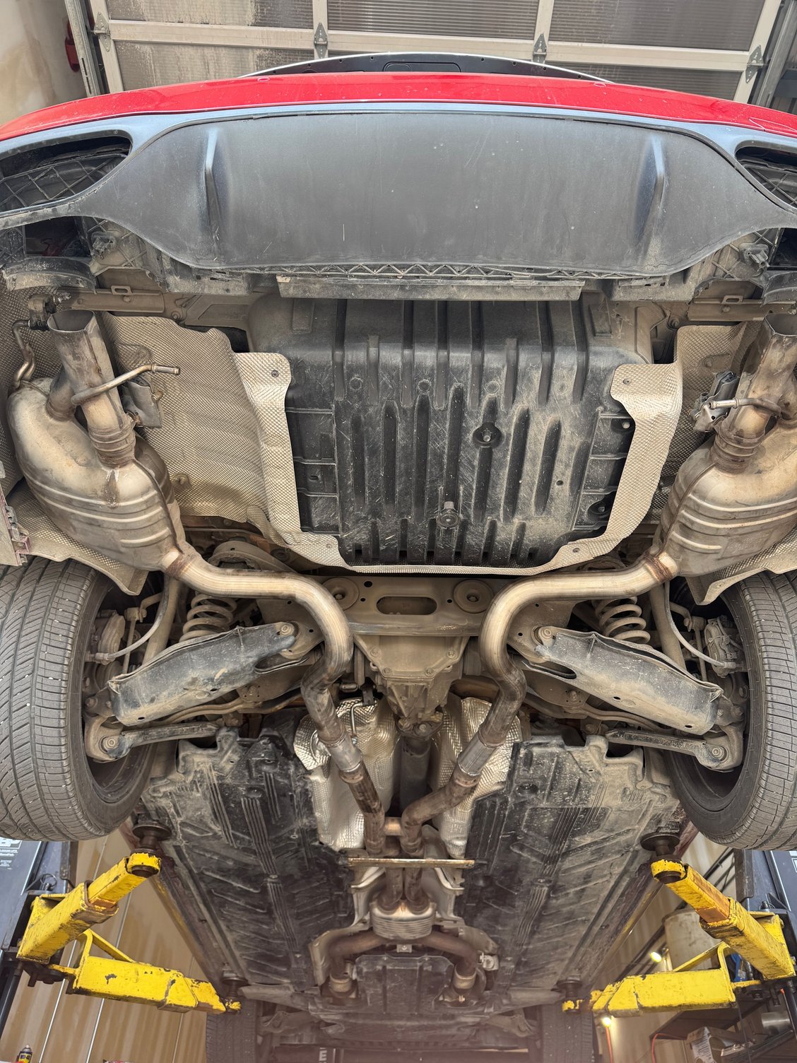 Midpipe extended and mufflers welded on (using stock hangers for now)
