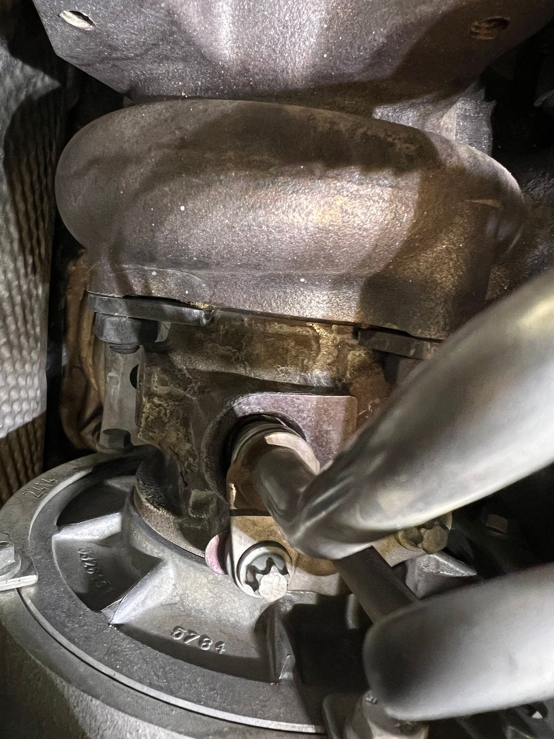 Car asks for coolant every three months.  Some searching reveals this stained mess. 