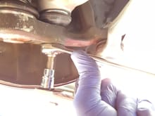 use a 21mm socket and a T45 torx bit to tighten the nut down on the ball joint. use the T45 torx bit to hold the inner screw while tightening the nut.