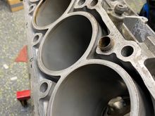 Here is a photo meant to depict a before and after example of lapping the aluminum engine block cylinder walls. The aluminum actually has 30% silicon content and a process using felt pads on a hone coated with alusil honing paste(the cylinder walls also get coated with the paste and regular engine oil in the process) brings forth the silicon for the piston rings to slide on. The silicon is much more durable than the aluminum alone which is part of the reason m113’s typically last a long time