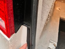 This is the section of weather strip that I pulled out to cover the gap between body panels. But there’s still about 3” left of body panel gap below this angled section of weather strip. Wondering if it’s supposed to seal all the way to the bumper. Mine has a slight opening there where water presumably enters and exits behind the rear bumper 