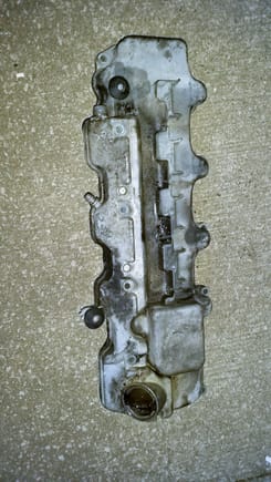 Valve cover before cleaning.