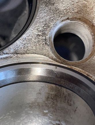 Noticed this AFTER first pass with 350 grit , it later went away with 450/700 & I finished with 1000 grit , I did the same process for all the other valves by hand no drill . Hit them all with 350/450/700/1000 grit diamond lapping paste . This was the only valve seat that had this problem 