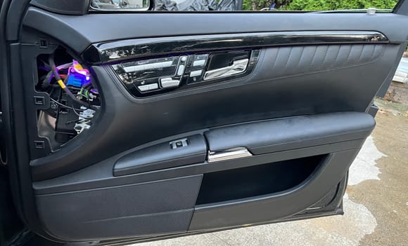 After: this is designo door panel with the led kit installed in the oem oem lens where the ambient light comes from. Unfortunately during the day you really can see the led light colors. As you can see I opened the door panel so you can see the the led color is purple 