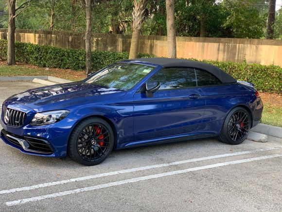 Black badges, powder coated wheels, ceramic coated, vinyl wrapped handles and frame around convertible top. 