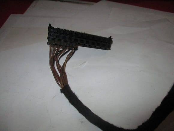 That black tape leaves a pile of black sh1t all over the wires. It comes off perfectly with engine degreaser.