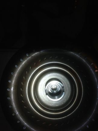 M156 Torque Converter mounted to flywheel ex-situ. See the teeth that fir around Input Shaft.