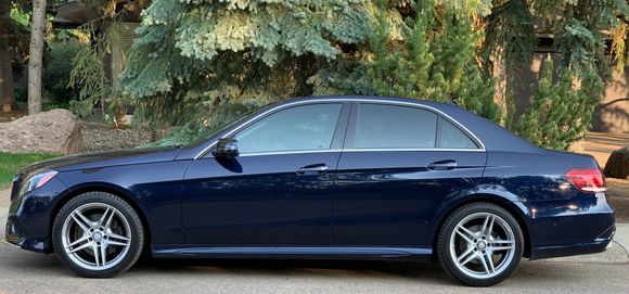 2015 E400 4MATIC (W212-067) in Cavansite Blue with Replika wheels.