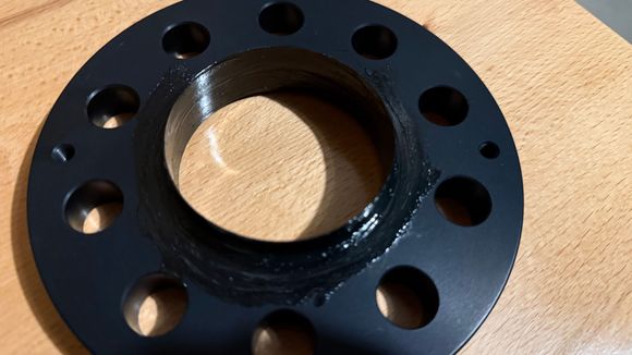 Greased inner and outer and very then layer on front and rear mounting surfaces then wiped the surfaces off. Left grease in the hub diameter parts (did not wipe off those)