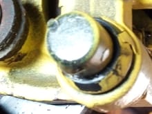 This is the bolt after I remove a cap on it.  I thought it was the one I was to tighten but it did not seem to do much.
