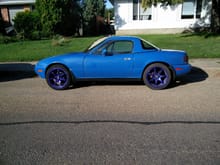 The Miata with the hardtop and the new wheel back on!