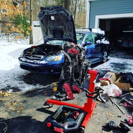 Rebuilding Kelseys motor outside in the snow.