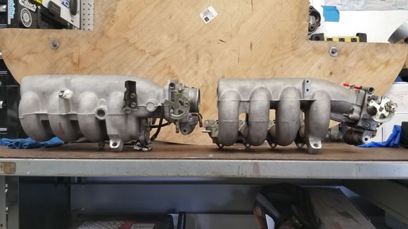 Side views of both JDM NB6 (left) and USDM NA6 (right) IMs with NB throttle bodies mocked up. Note the longer and straighter approach to the plenum from the TB for the USDM NA6 IM.